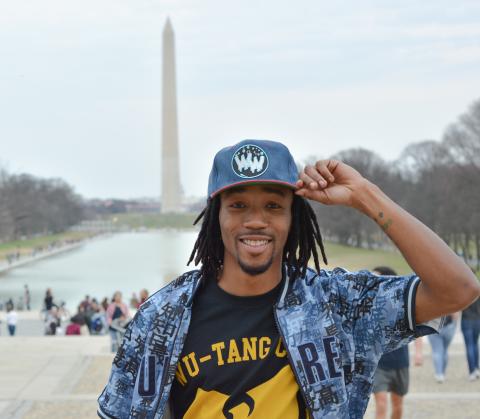 Marcelus Ifonlaja poses in front of Washington Monument