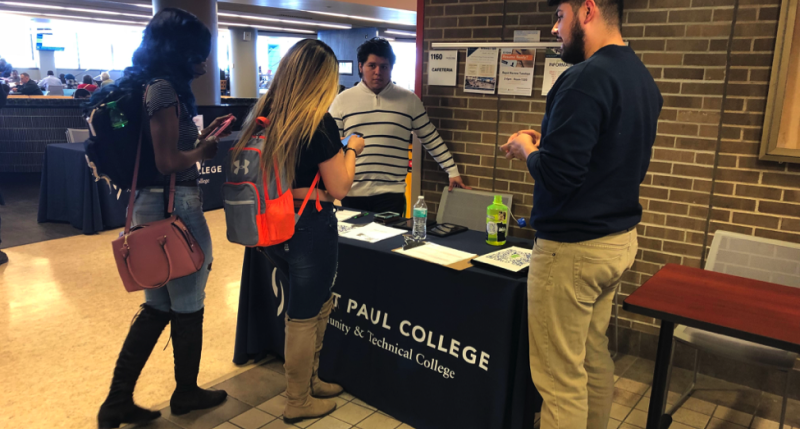 LeadMN students discussing the impacts of DACA with students at Saint Paul College