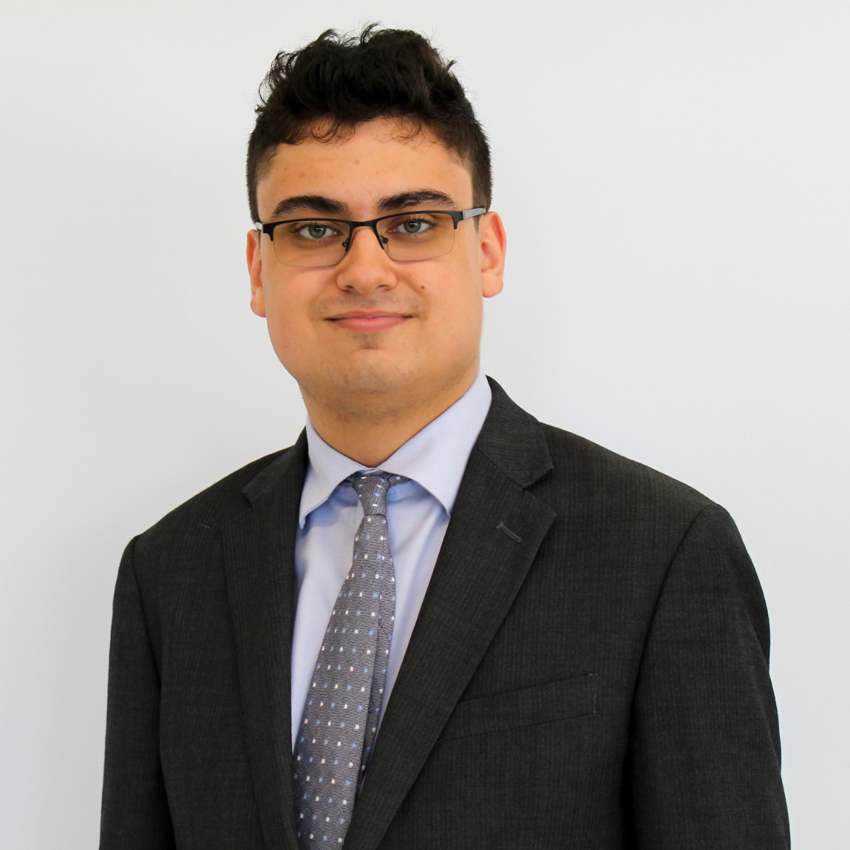 photo of Aaron Eischen, vice president, in front of a grey/blue background